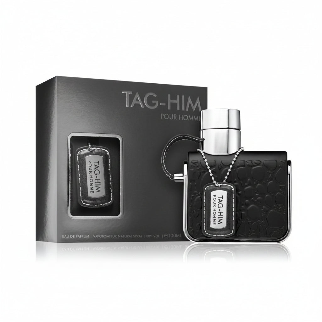 ARMAF TAG HIM perfume bottle with box and spray nozzle, predominantly black in color.