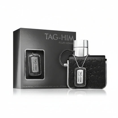 ARMAF TAG HIM perfume bottle with box and spray nozzle, predominantly black in color.